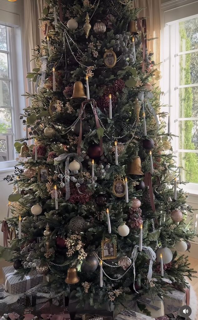 Large Christmas tree filled with mismatched vintage ornaments and collected decorations