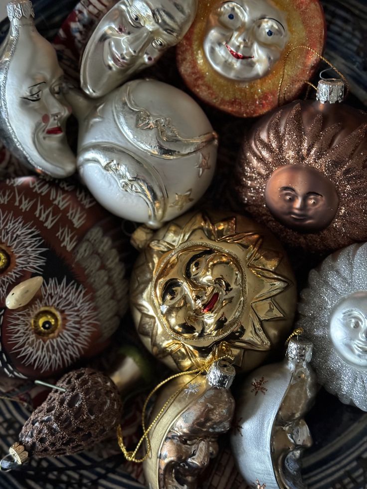Close-up of vintage glass Christmas ornaments in silver, gold and brown