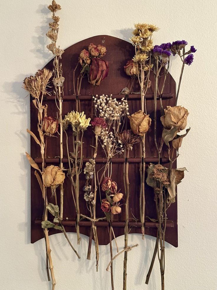 Dried fall flowers arranged in a vintage vase Dried fall flowers arranged in a vintage vase