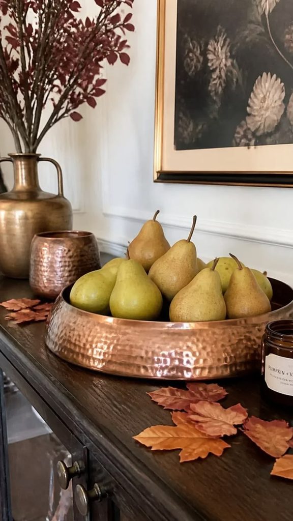 Apples and seasonal fruit styled in a rustic bowl Apples and seasonal fruit styled in a rustic bowl